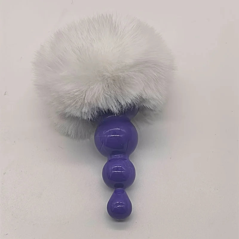 Bunny tail butt plug with white pom-pom tail and purple beaded plug